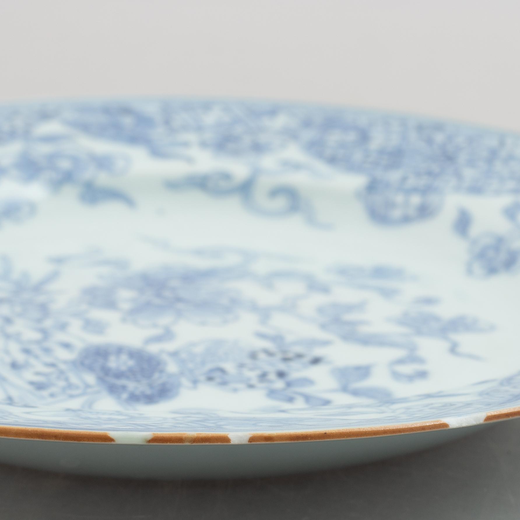 A group of four blue and white dishes and a cabaret piece, Qing dynasty, 18th century.
