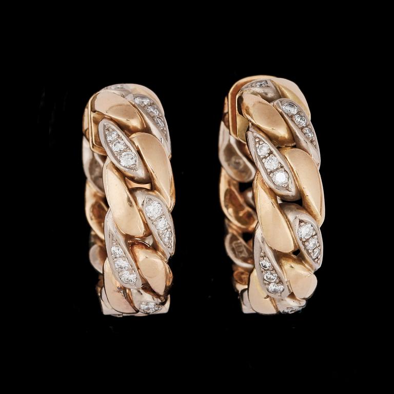 A pair of gold and brilliant cut diamond earrings, tot. app. 0.90 cts.