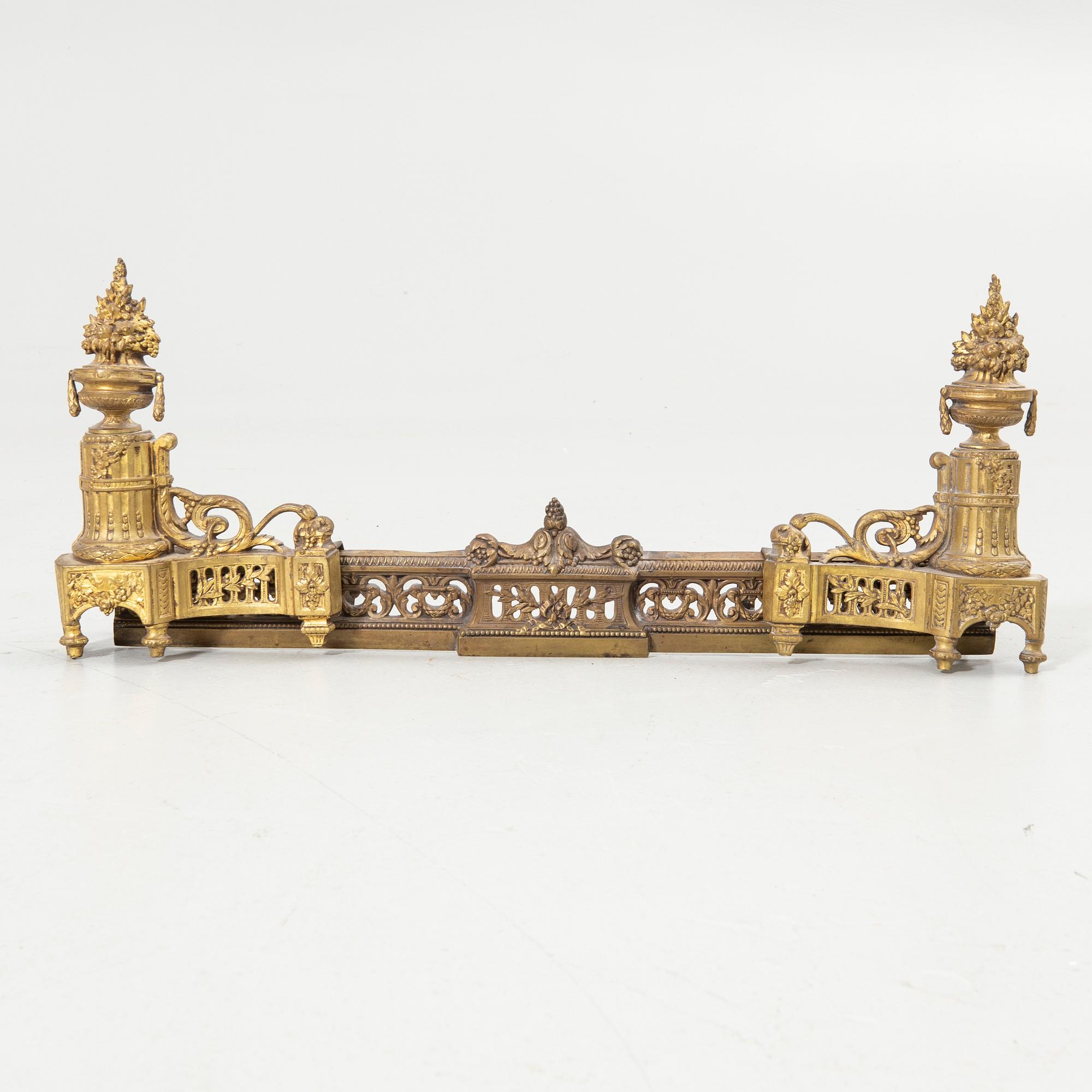 Pair of candelabra and a firedog, 18th/19th century.
