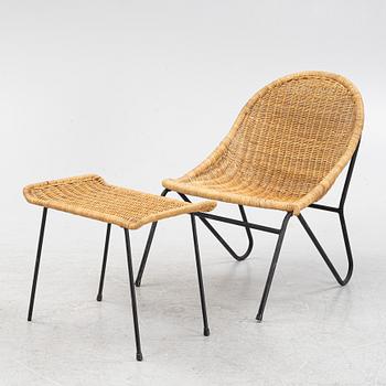 A rattan chair with ottoman, 1950's.