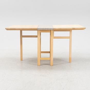 A birch gate leg table with a stone top by Marit Stigsdotter for Stolab, dated 2002.