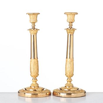 A pair of French Empire candlesticks, early 19th century.