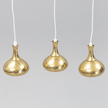 A set of three brass pendule lights, second half of the 20th Century.