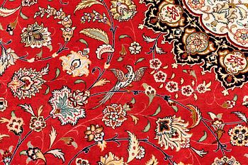 A carpet, Täbriz part silk, 341 x 248 cm.