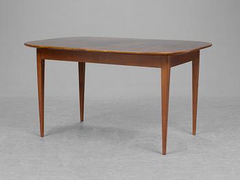 A Josef Frank walnut and mahogany dinner table, Firma Svenskt Tenn.