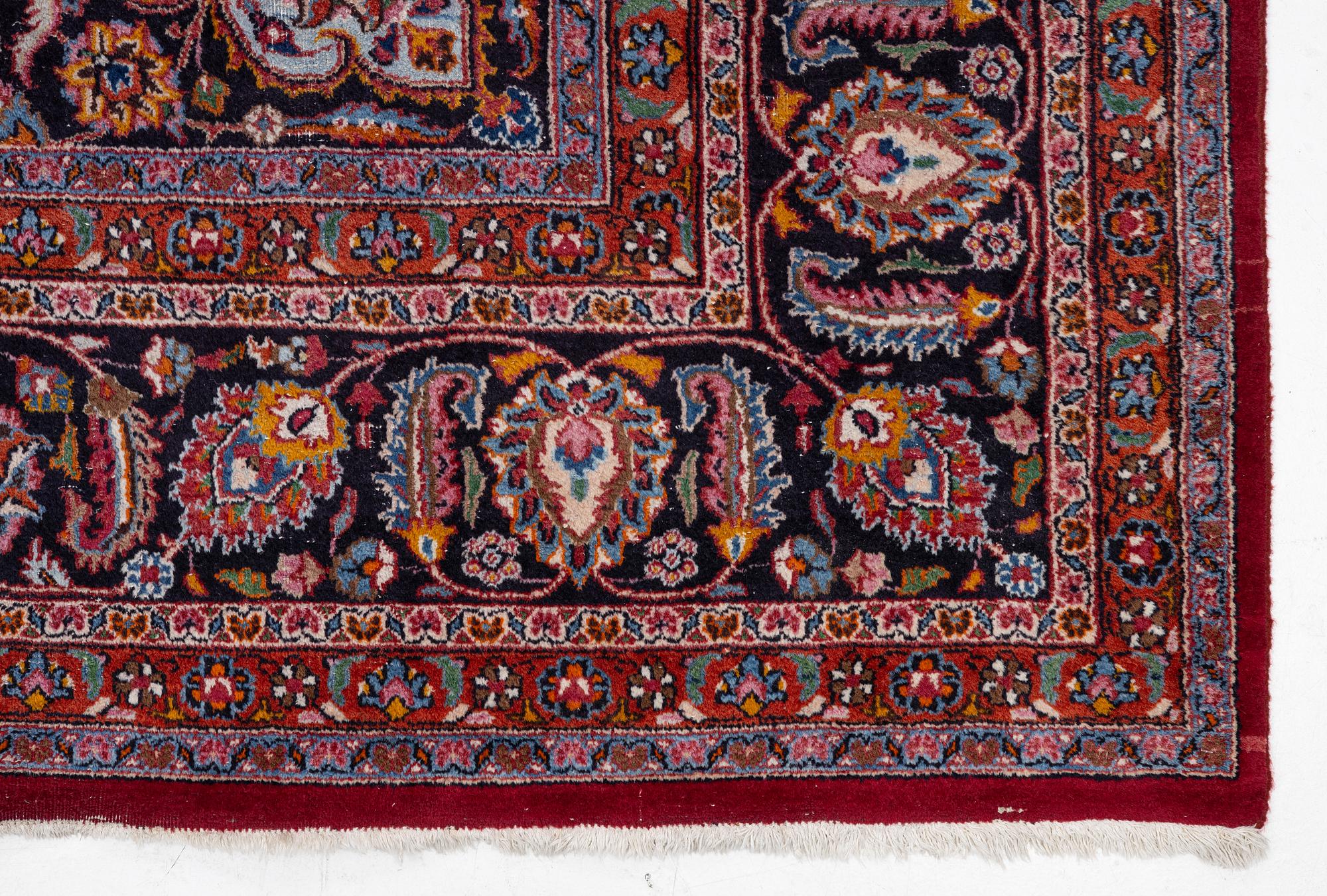 An Oriental carpet, approx. 380 x 304 cm.