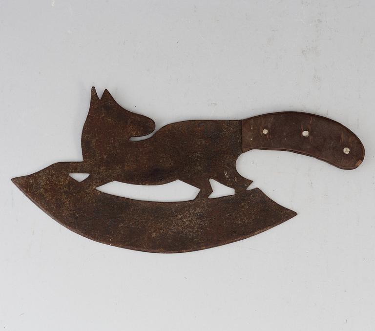 A 19th century iron meat cutter.