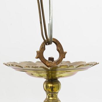 A baroque-style eighteen-branch brass chandelier, late 19th century.