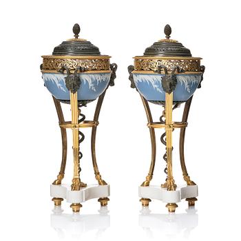 A pair of gilt bronze, marble and ceramic potpourri urns with covers, 19th century.