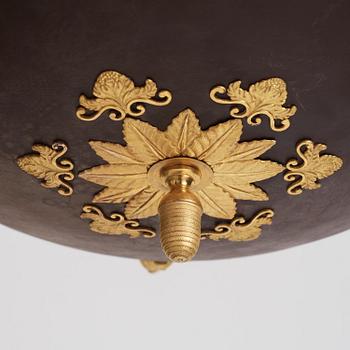 A Swedish Empire ormolu and tole six-branch chandelier, Stockholm, early 19th century.