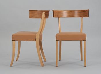 A pair of Josef Frank walnut, beech and brown leather chairs, Svenskt Tenn, model 300.