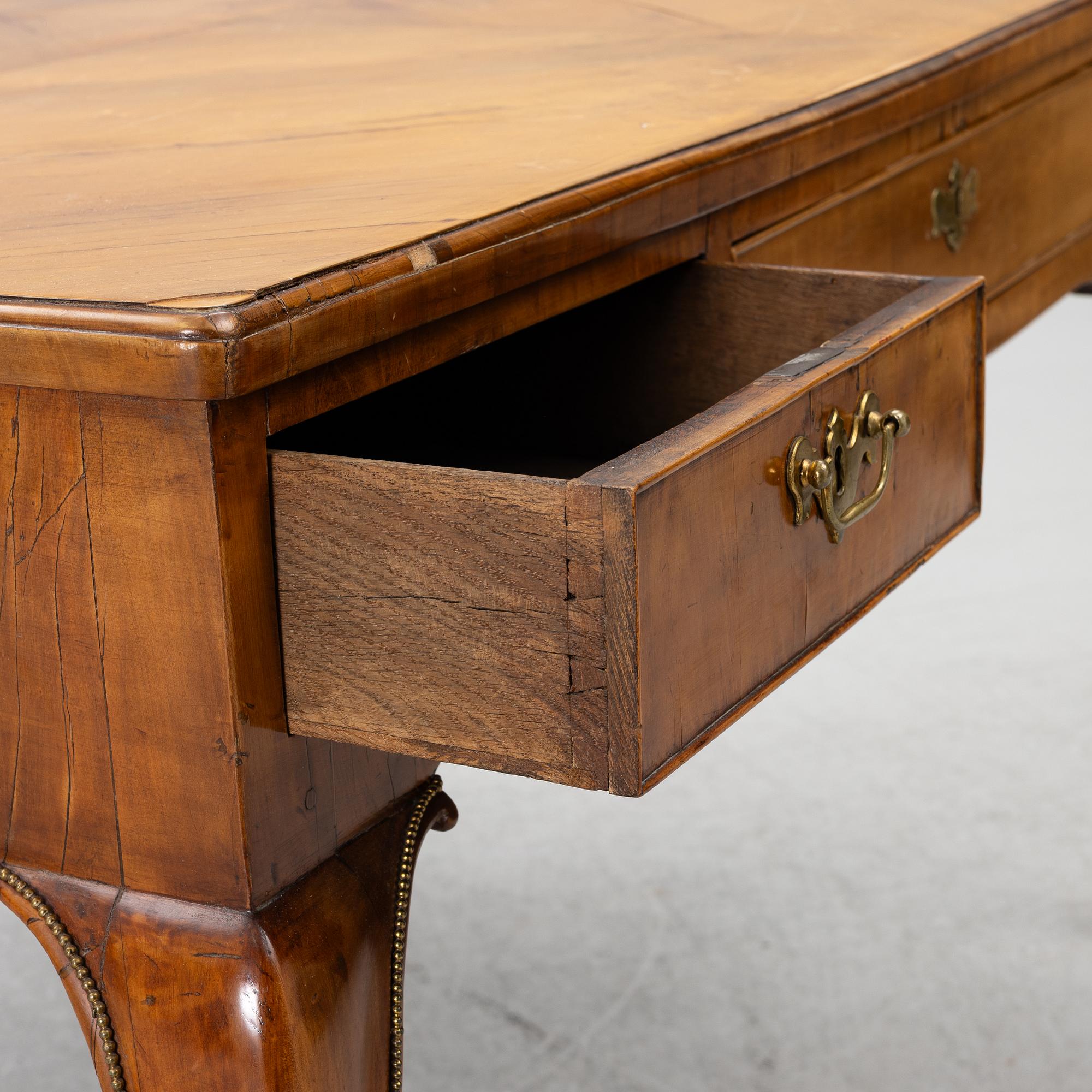 A George II walnut partner's desk, mid 18th century.