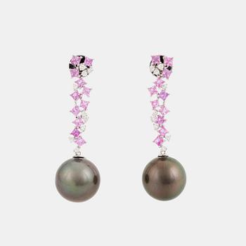 A pair of 18K white gold earrings set with Tahitian cultured pearls and round brilliant-cut diamonds.