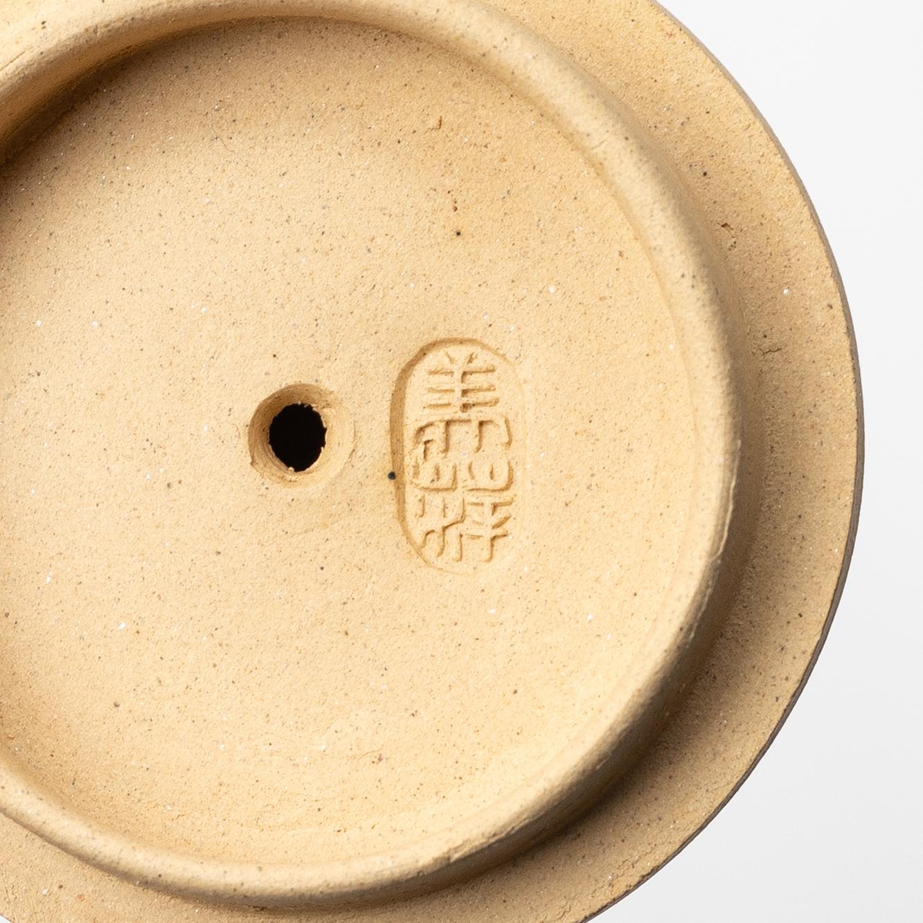 A group of three bright yellow yixing 'Gongfu' teapots, China, 1990s.