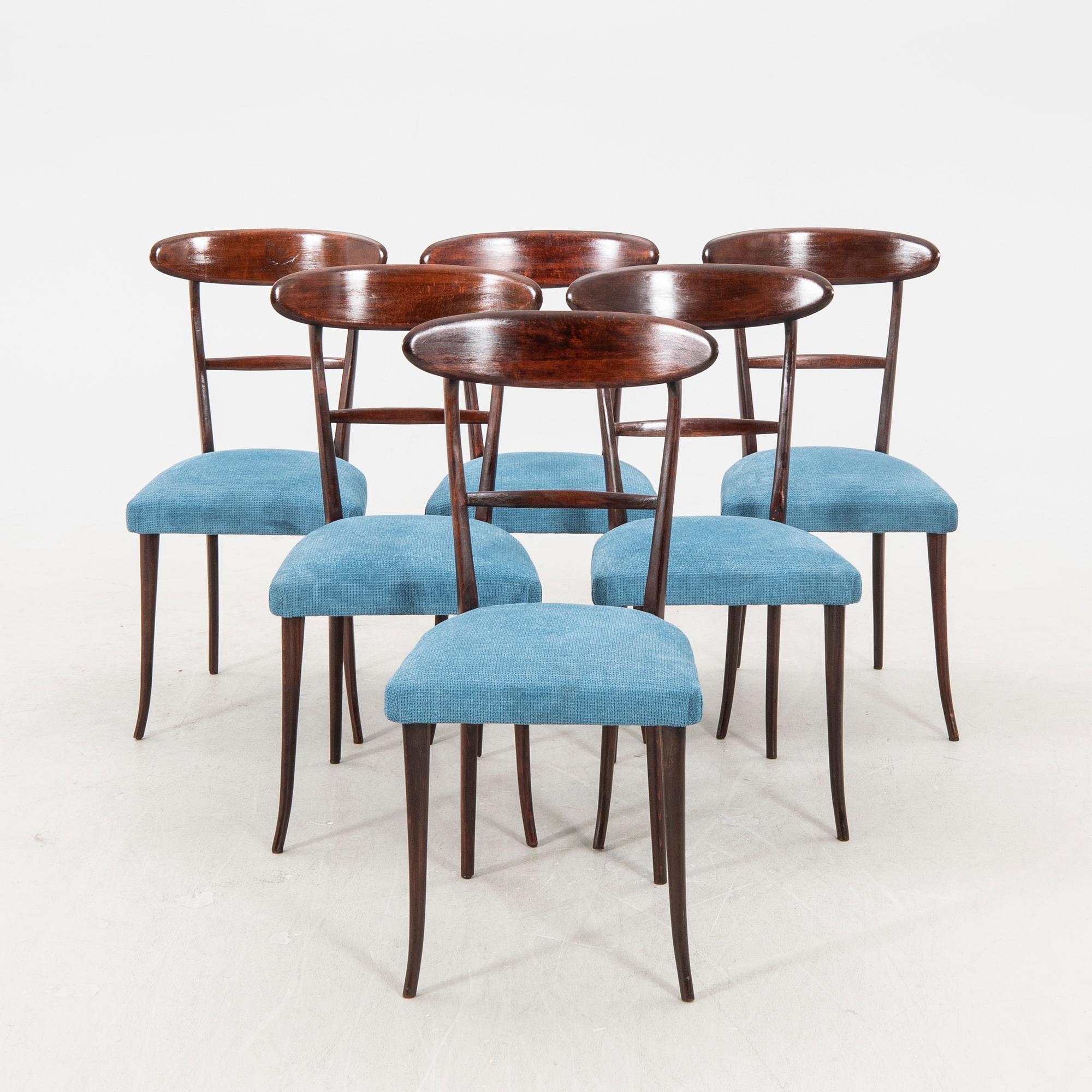 A set of six Italian Mid 1900s walnut chairs.