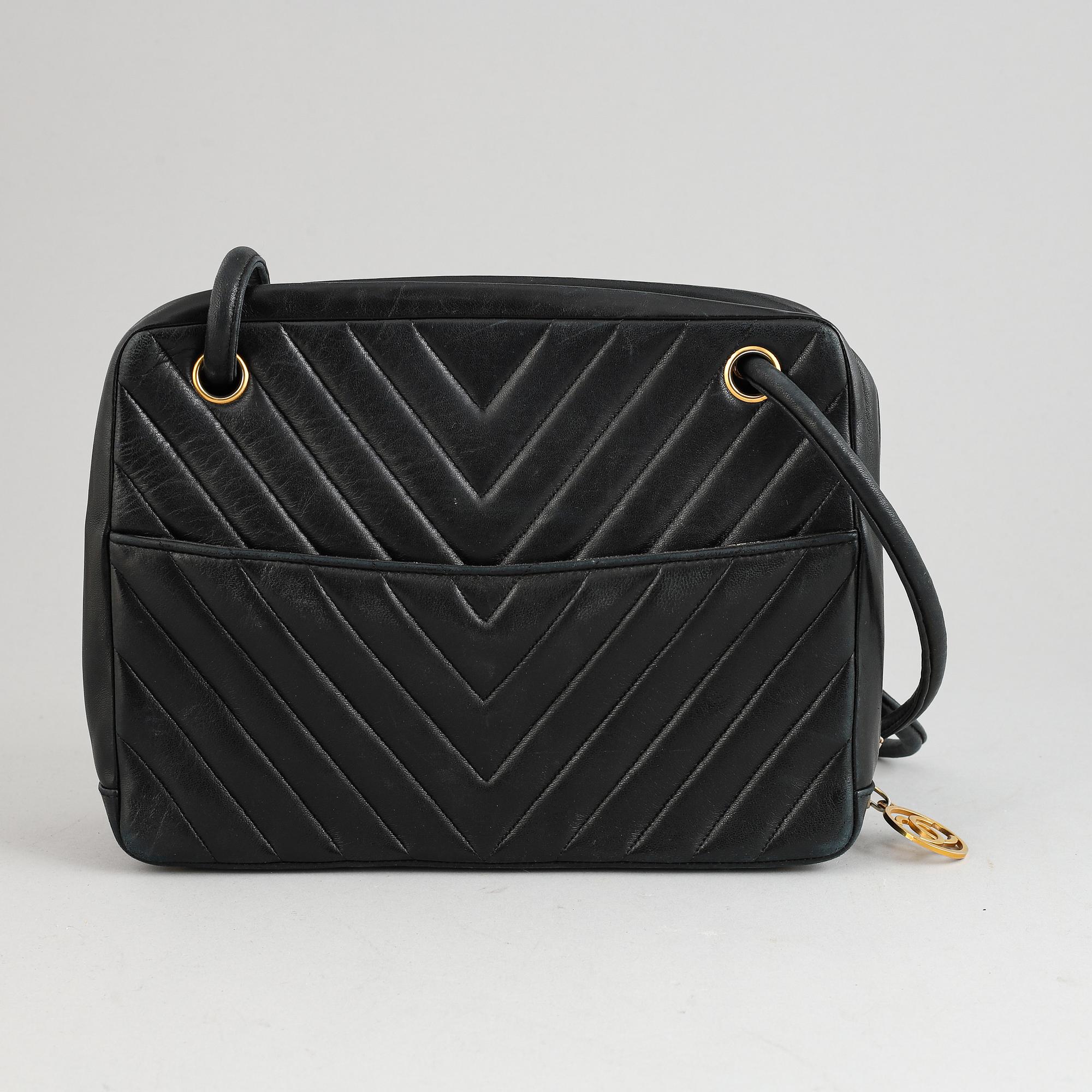 Chanel, a black leather handbag, 1980's.