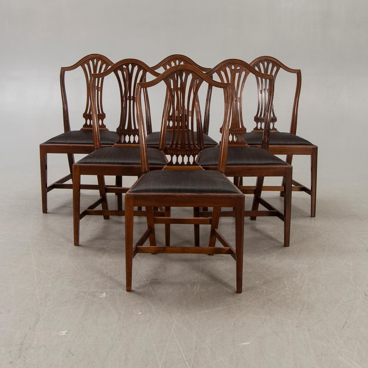 A set of six mahogany Hepplewhite style 20th century chairs.