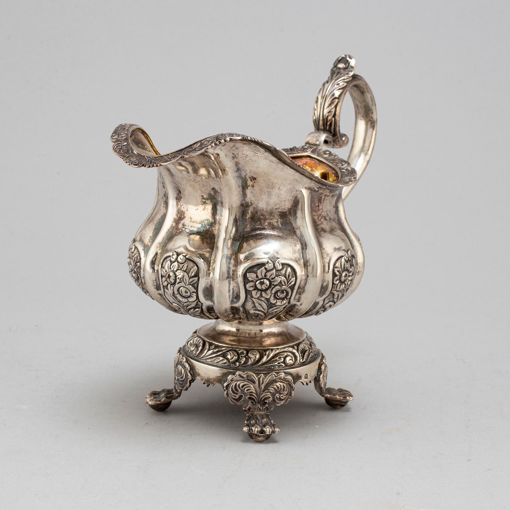 A Russian parcel-gilt silver creamer,  1842, probably Moscow.