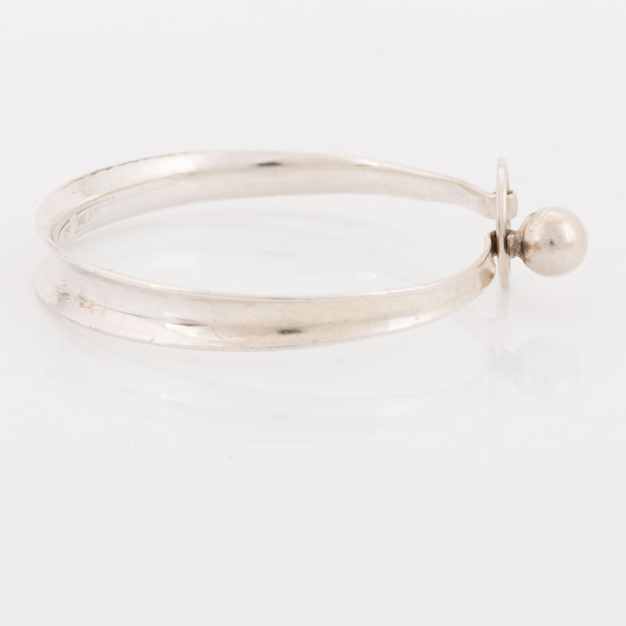 A silver Erik Granit bracelet.