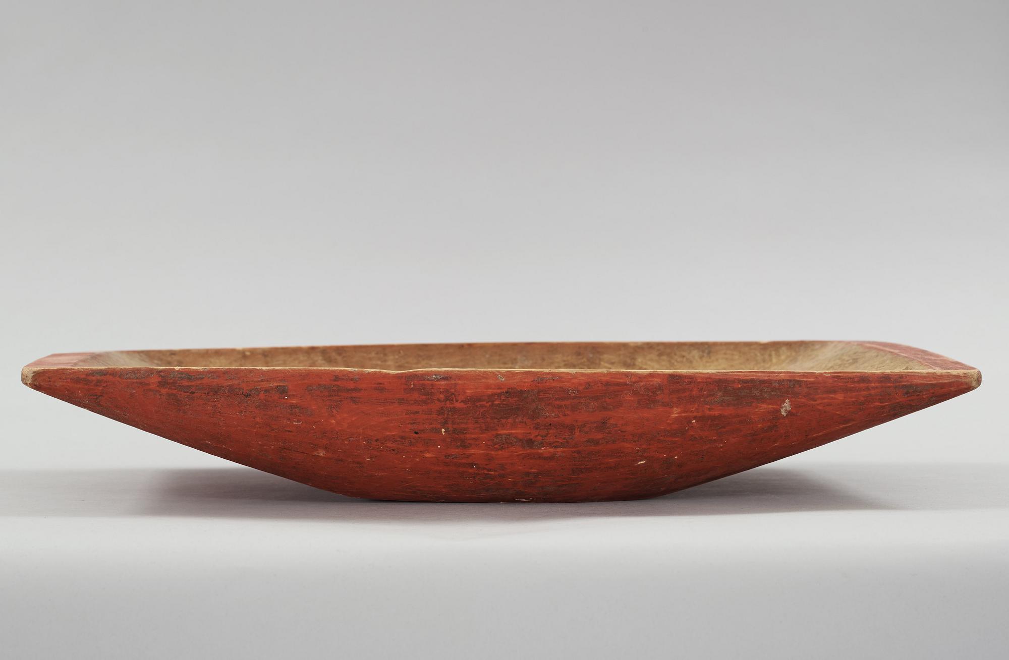 A wooden bowl from the 19th century.