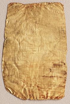 A set of nine presumably modern Egyptian-style gold foil sheets with figures and hieroglyphs.