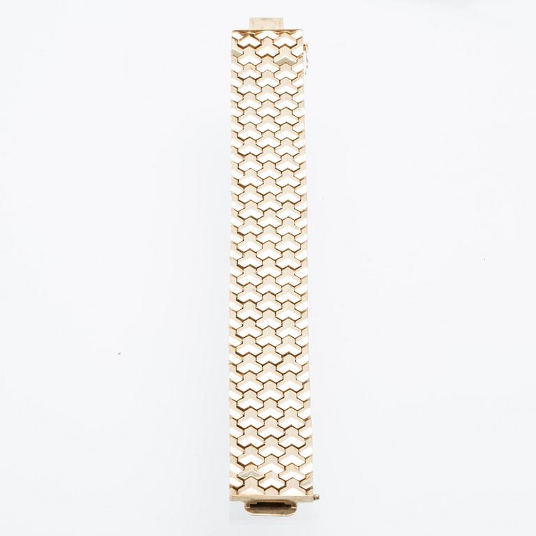 A 14K gold bracelet.