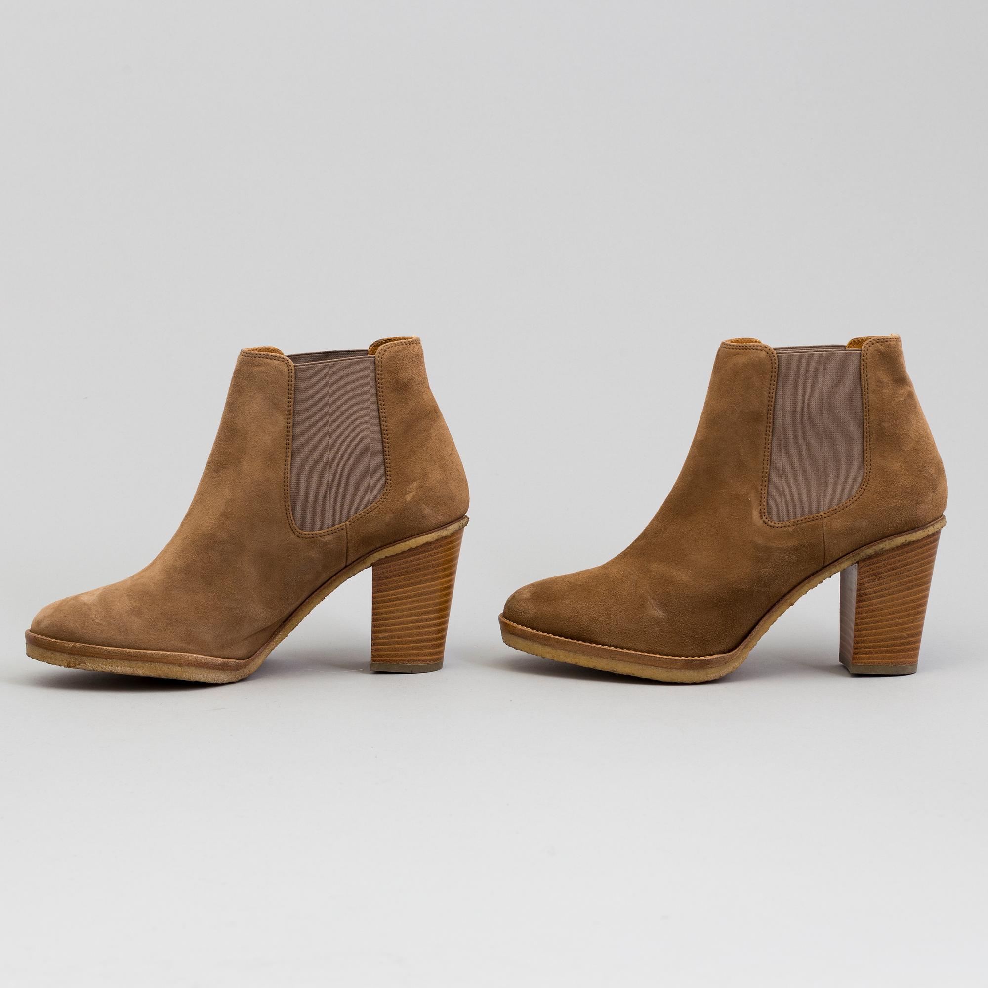 A pair of suede bootie byRalph Lauren.