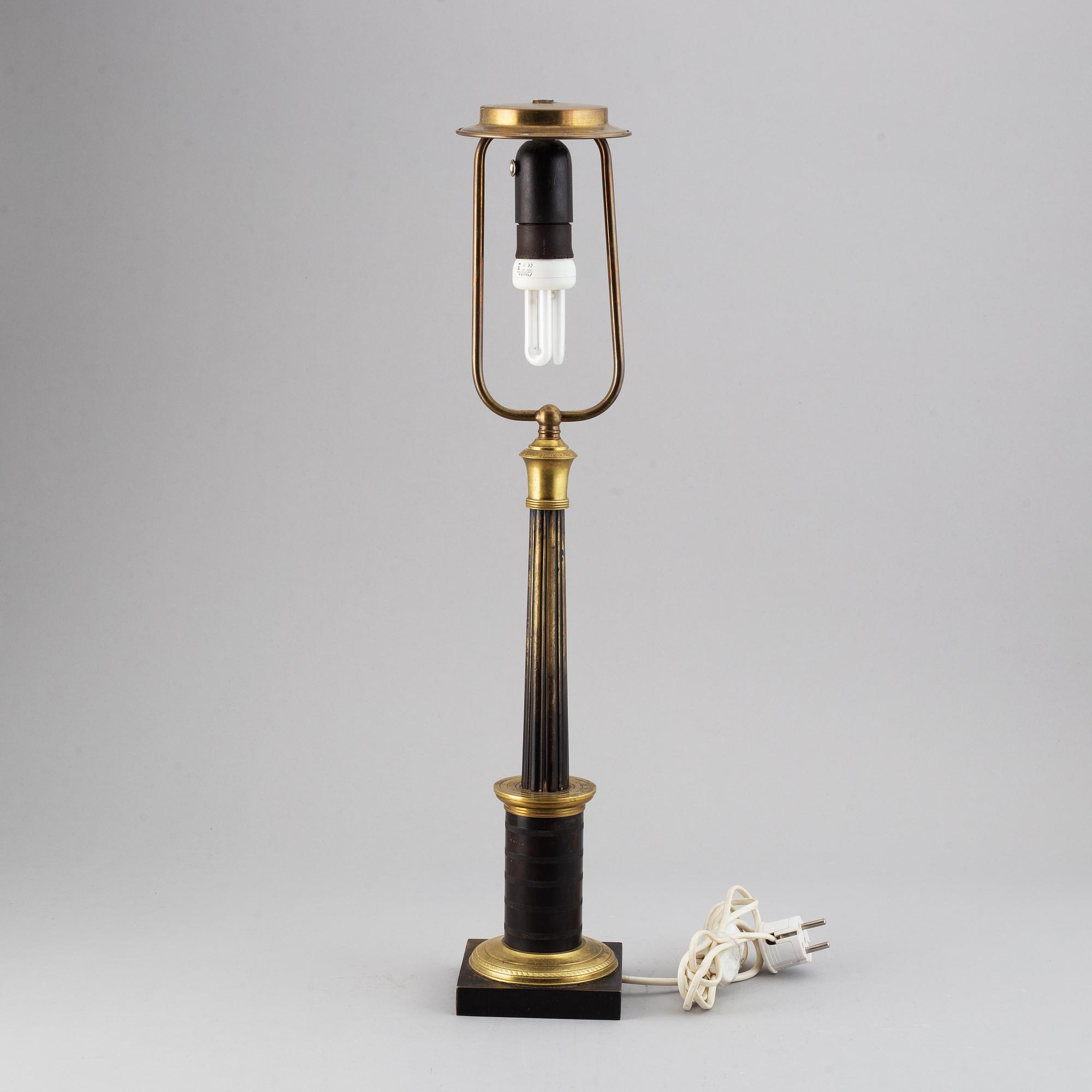 An empire style table lamp from the first half of the 20th century.