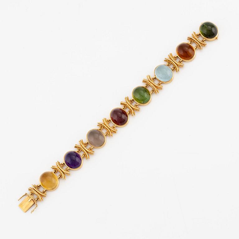 A W.A. Bolin bracelet, design Barbro Littmarck, 18K gold with cabochon-cut coloured stones, Stockholm 1970.