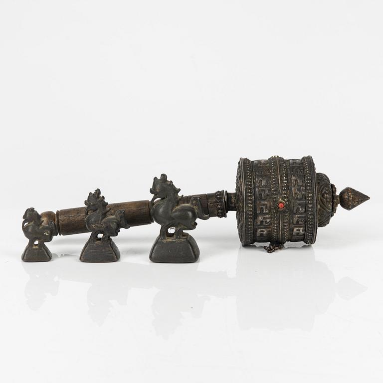 A Tibetian prayer wheel and three bronze opium weights, probably Burma.