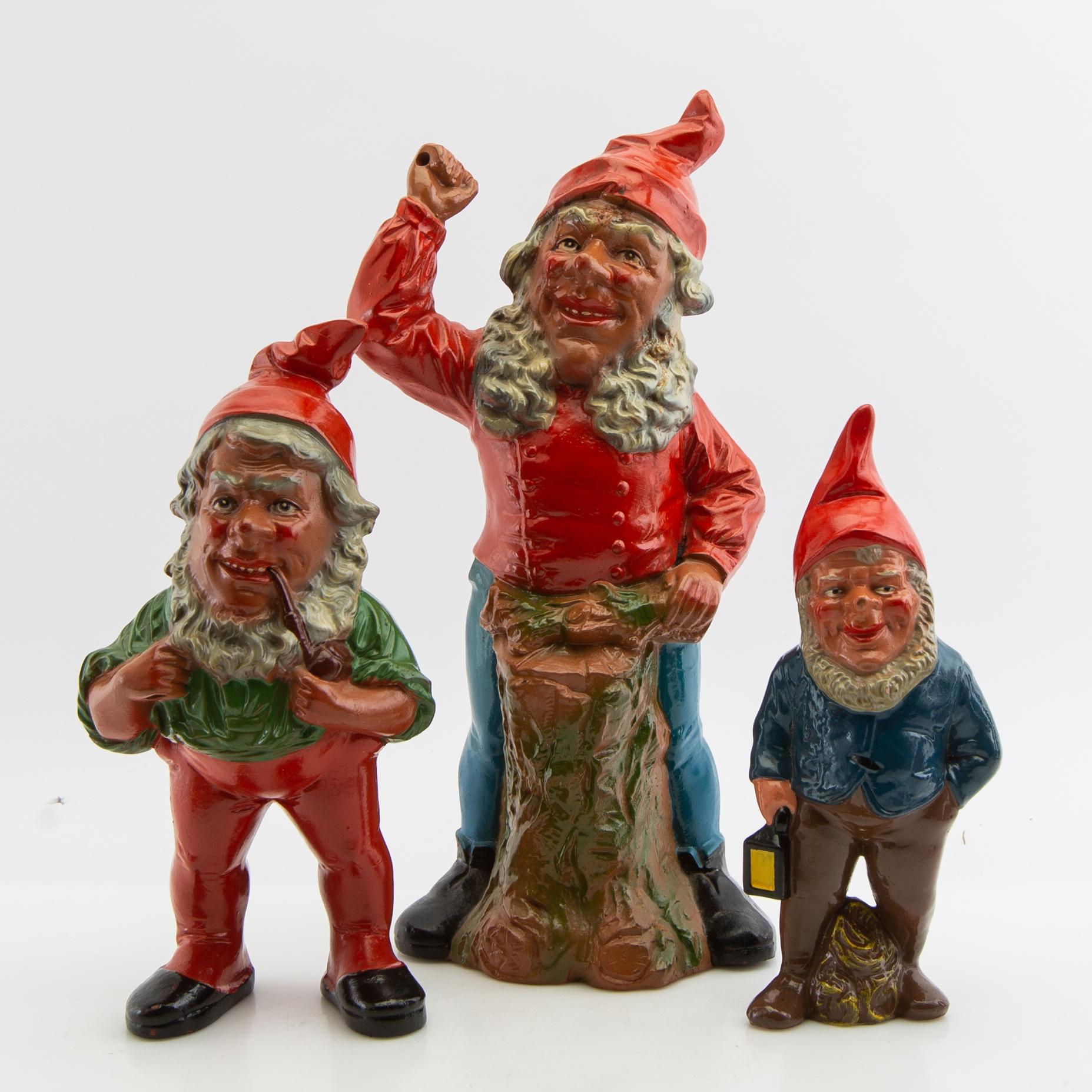 A collection of gnomes 12 pcs mid/late 20th century mostly painted terracotta.