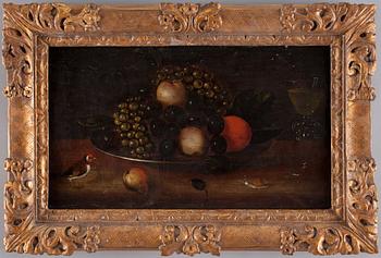 Still life with fruits, a bird, snail and a glass goblet.