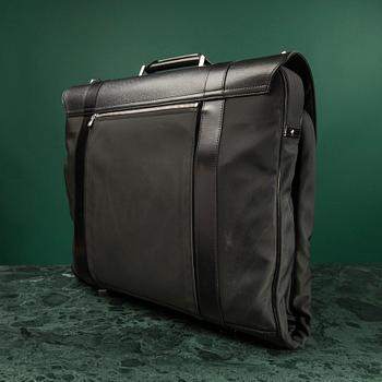 A Garment bag by Louis Vuitton.