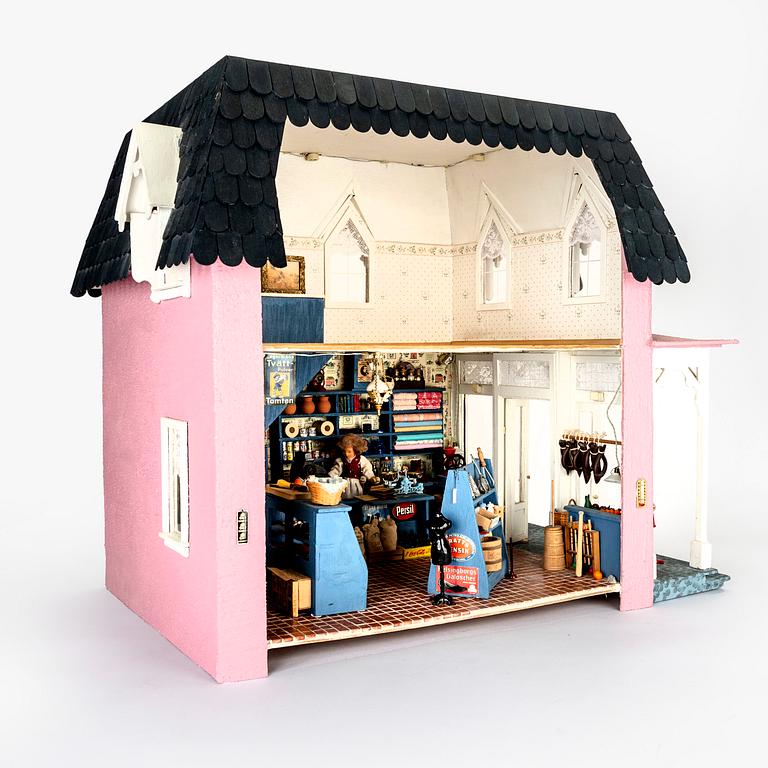 A handmade dolls house later part of the 20th century.