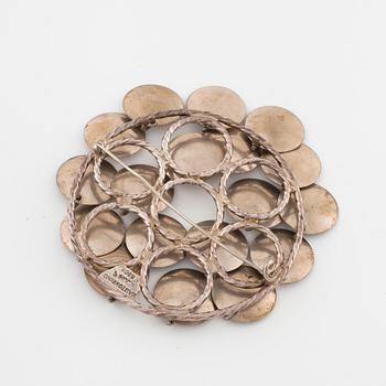 FRANK JUHLS, Kautokeino, Norway, a brooch.