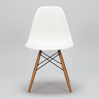 A 'Plastic chair DSW' by Charles and Ray Eames for Vitra.