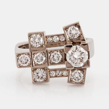 1121. A Claës Giertta 18K white gold ring set with round brilliant- and eight-cut diamonds.