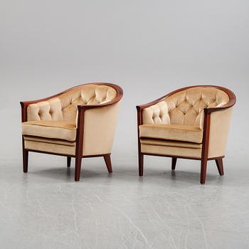 A pair of mahogany and velvet easy chairs by Bröderna Andersson, 1960's.