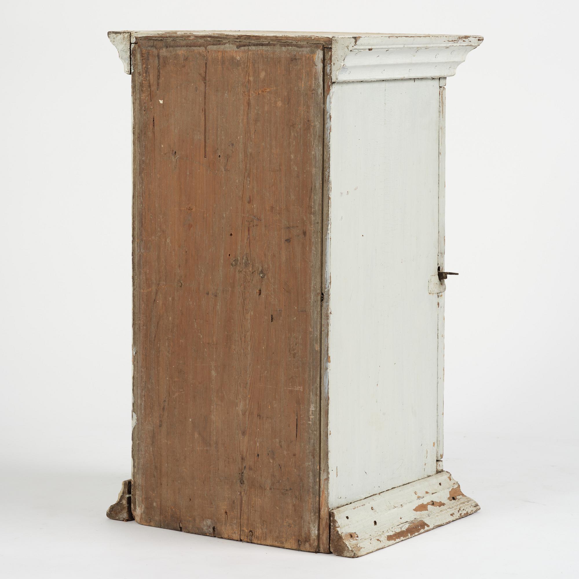 A Gustavian column-shaped cabinet, circa 1800.