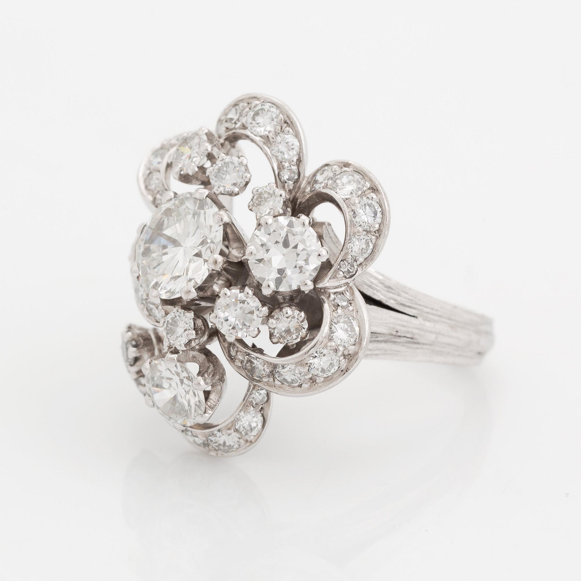 An 18K white gold WA Bolin ring set with round brilliant-cut diamonds.