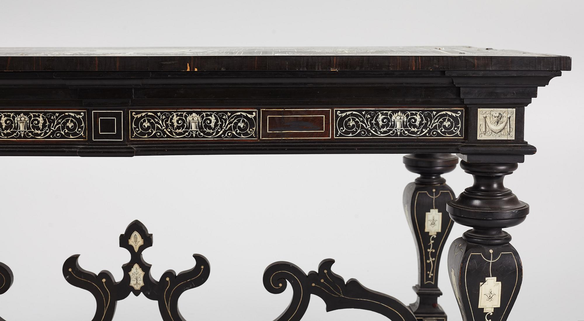 A Renaissance-style ebony, ebonized and ivory-inlaid library table, late 19th century, presumably Germany.