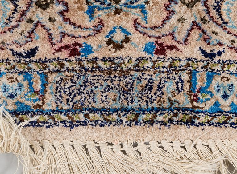 A oriental signed Nain silk carpet. Circa 267x163 cm.