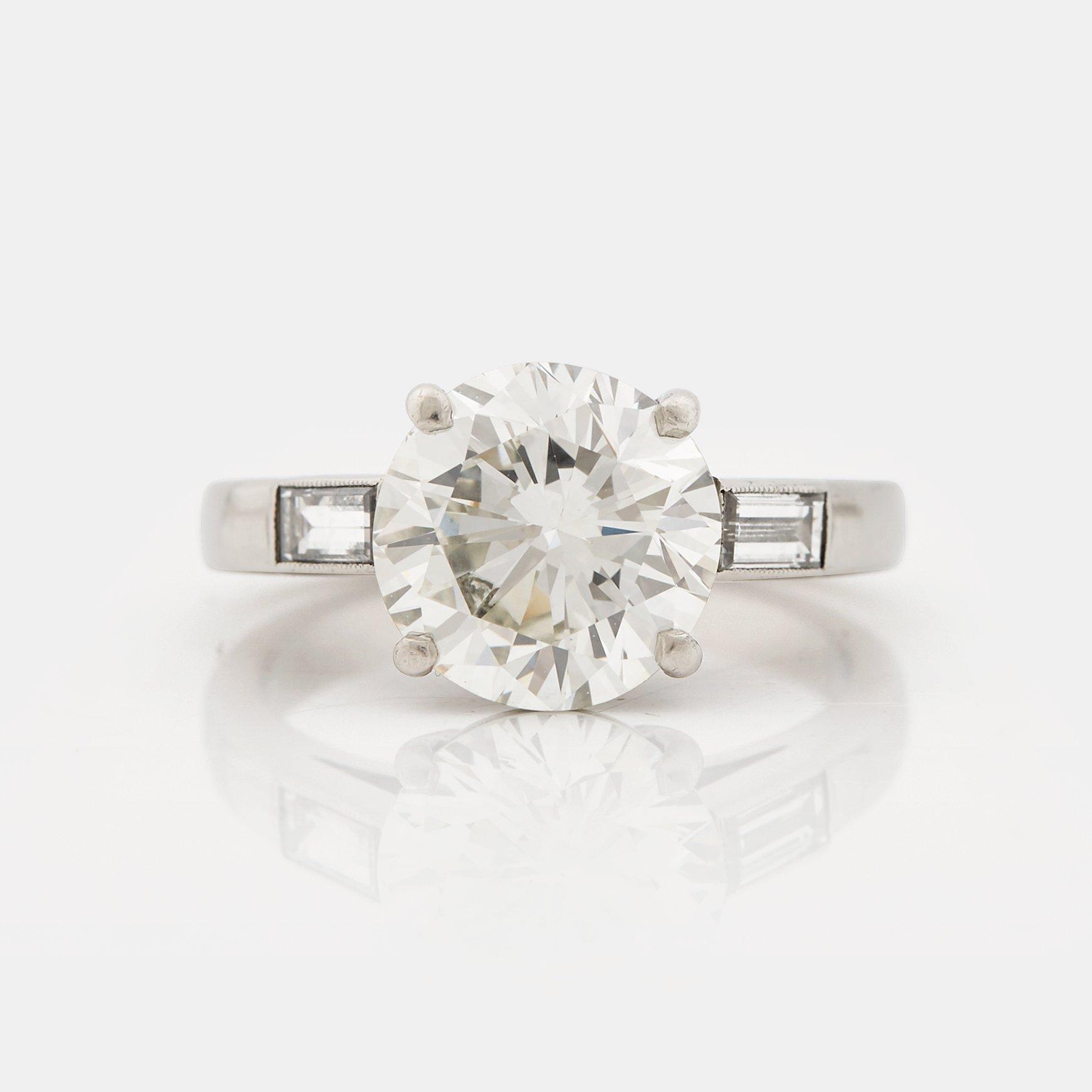 A brilliant- and baguette cut diamond ring, Bentley & Skinner, London.