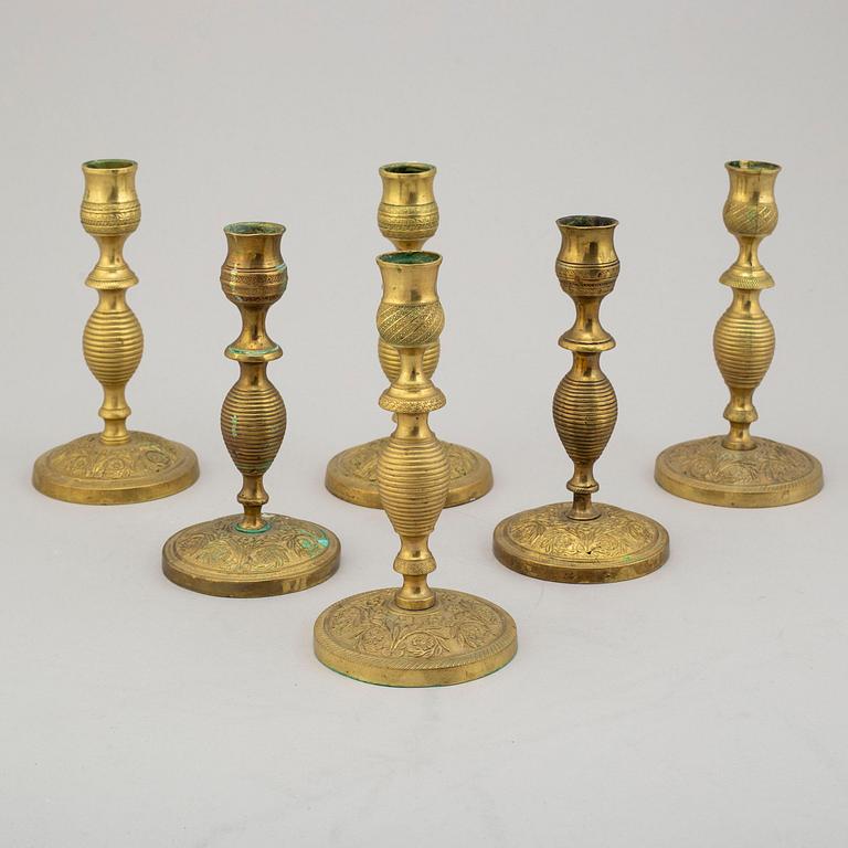 A set of 6 brass candlesticks, (3 pairs), 19th century.