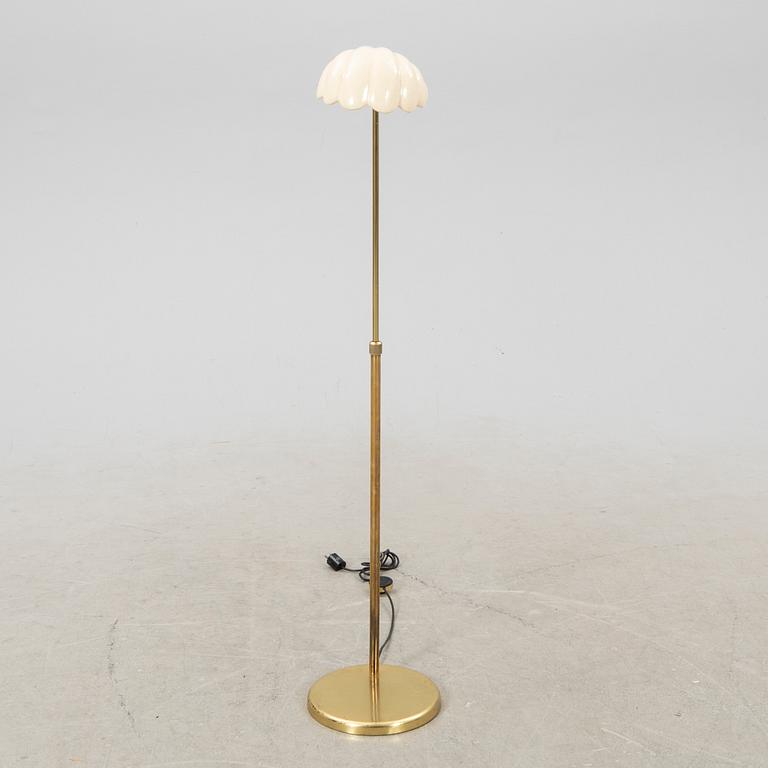 A late 20th Century floor lampp with a shell formed shade.