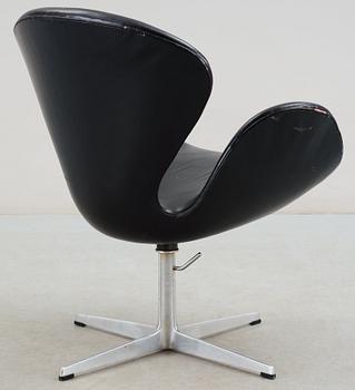 An Arne Jacobsen black leather 'Swan' easy chair, Fritz Hansen, Denmark 1960's.