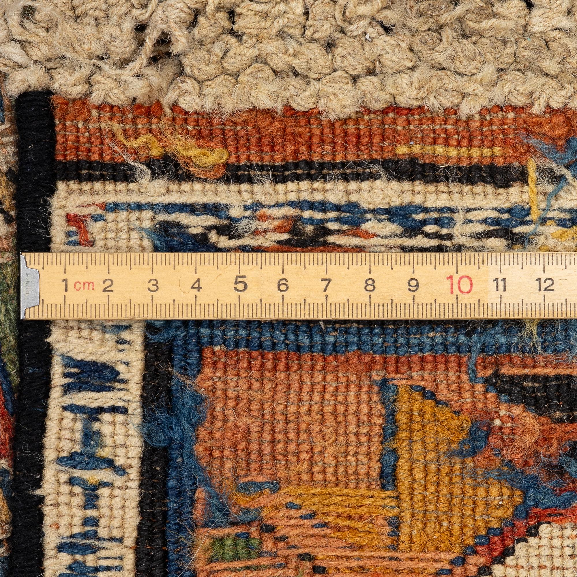 An oriental carpet, c 280 x 130 cm.
