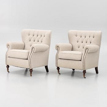 A pair of armchairs, early 21st century.