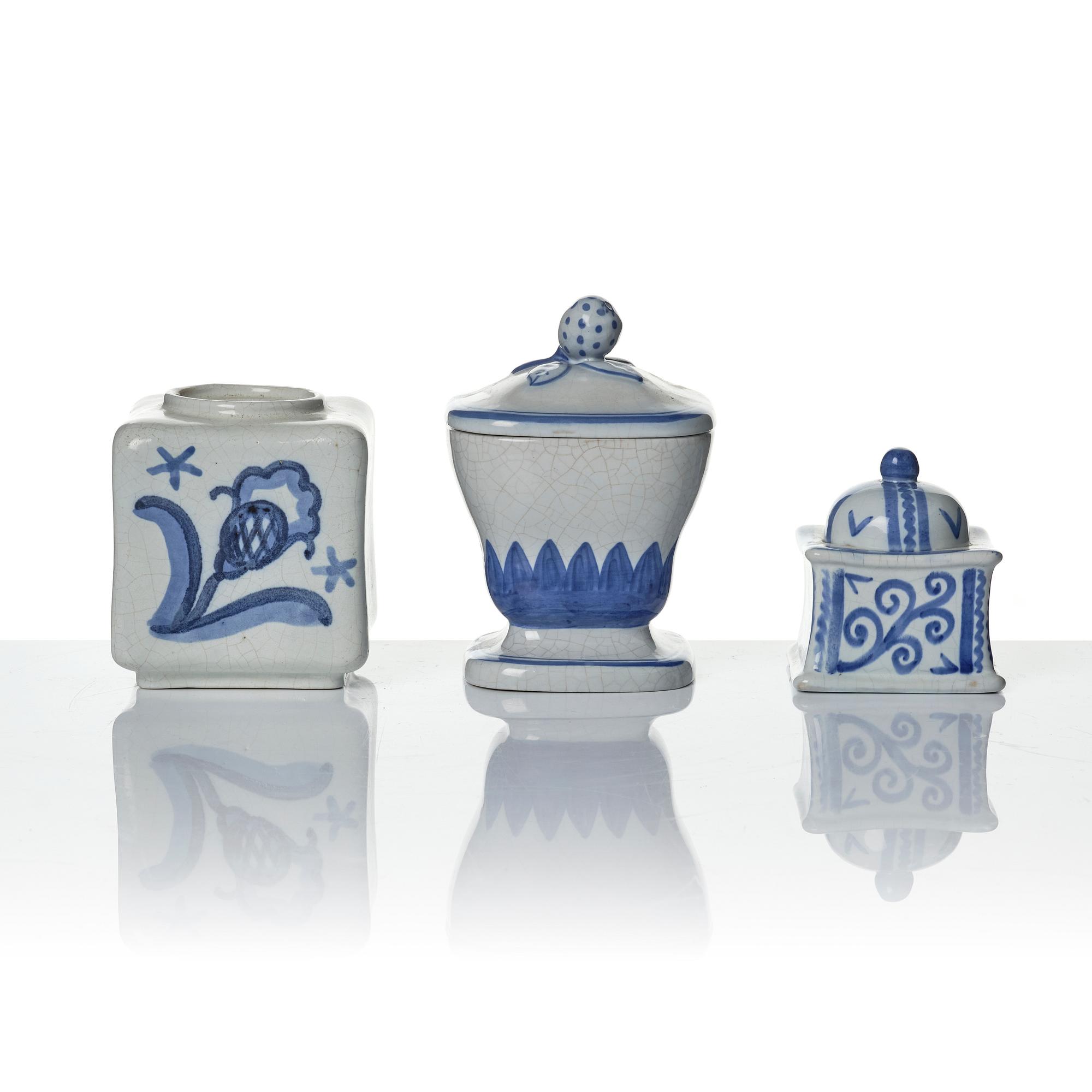 Wilhelm Kåge, eleven pieces of faience including jars, inkwells and a tulip vase, Gustavsberg, Sweden, 1919-1920.