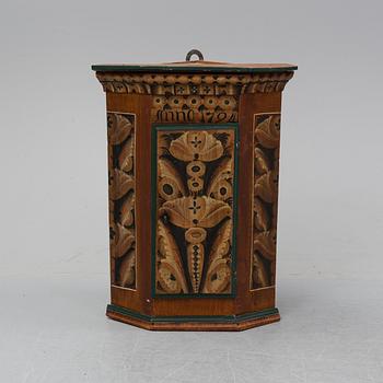 A painted corner cabinet, dated 1794.